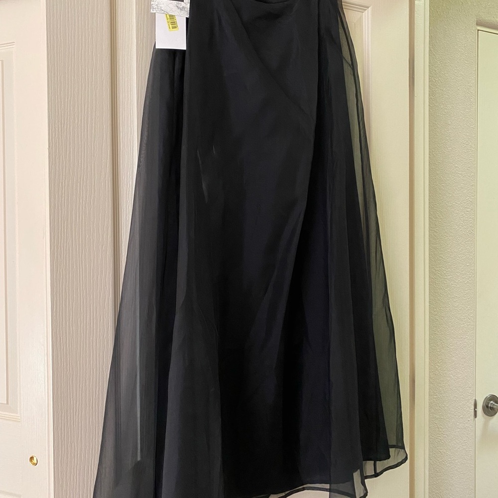 New, with tags, classic black maxi skirt.